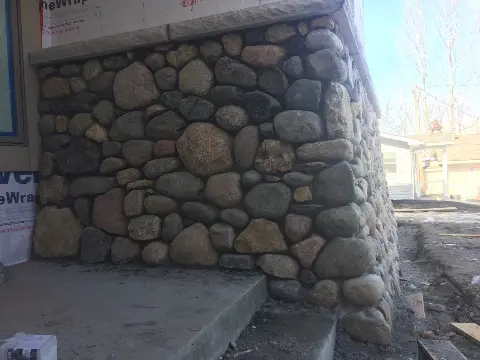 Natural stone foundation with rounded pebbles in Minneapolis